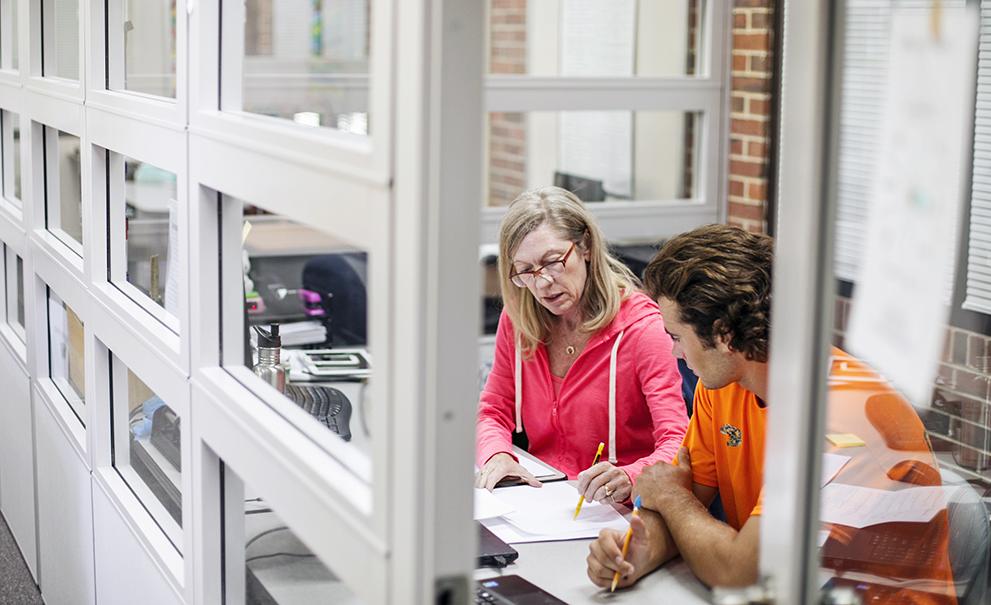 teacher speaking with student